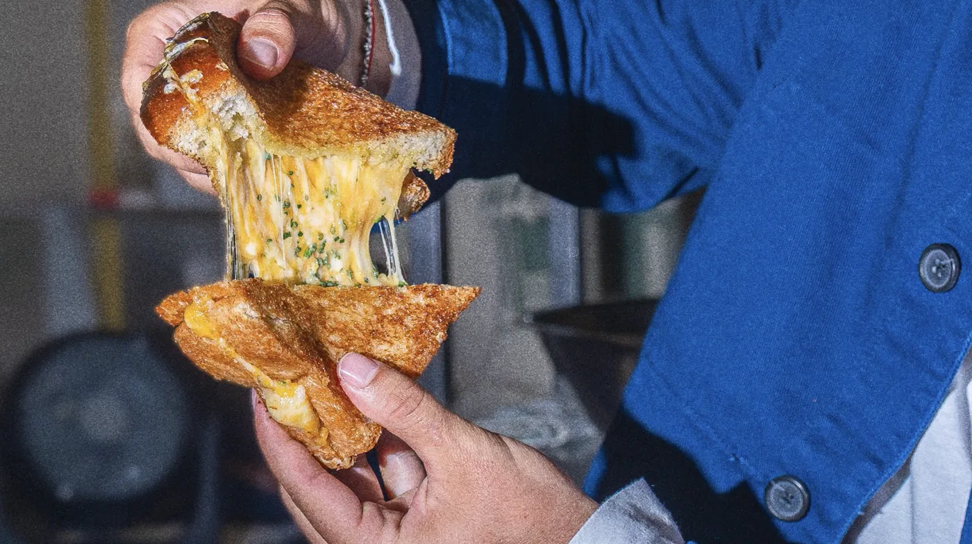 The grilled cheese, pulled apart